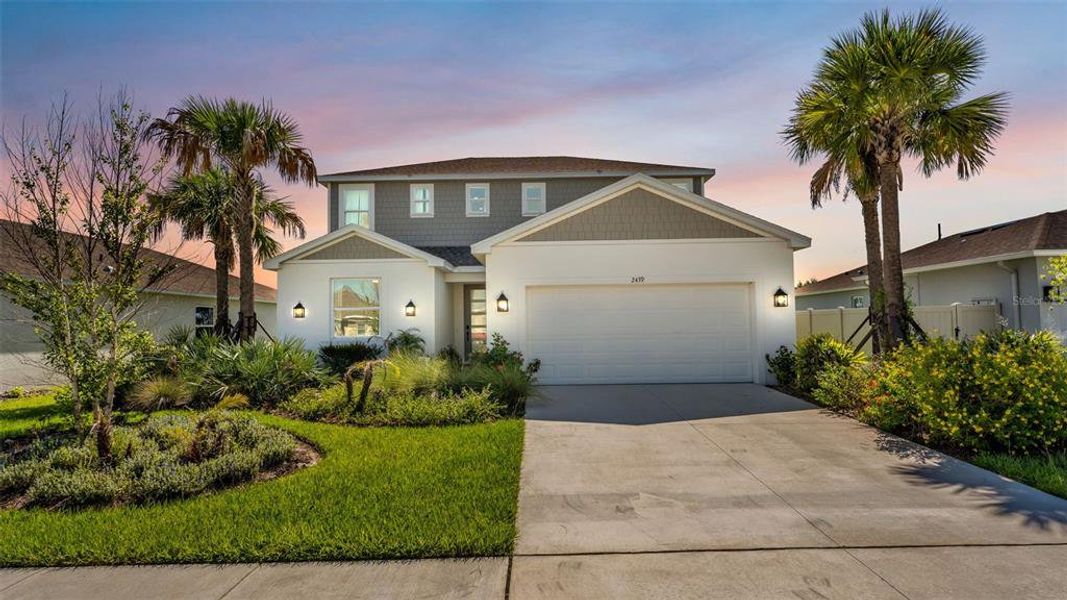 Front exterior of a new home in , Auburndale, FL, highlighting curb appeal (Image 2). Front exterior of a new home in , Auburndale, FL, highlighting curb appeal (Image 2).