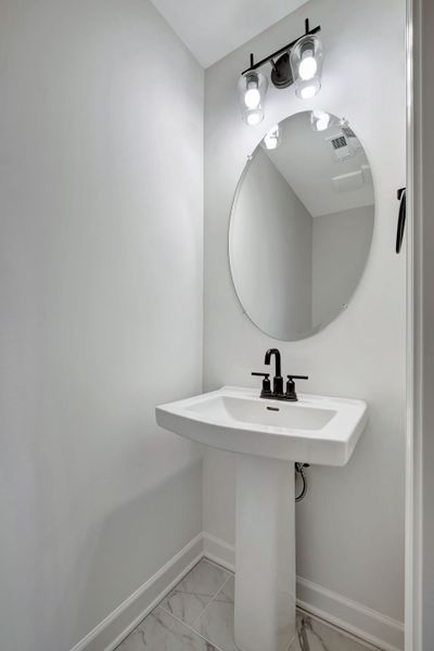 Stylish 1st Floor Powder Room in The Ingram Townhome