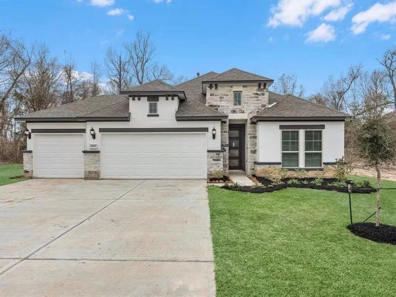 Front exterior of a new home in Encino Estates, Dayton, TX, highlighting curb appeal (Image 1). Front exterior of a new home in Encino Estates, Dayton, TX, highlighting curb appeal (Image 1).