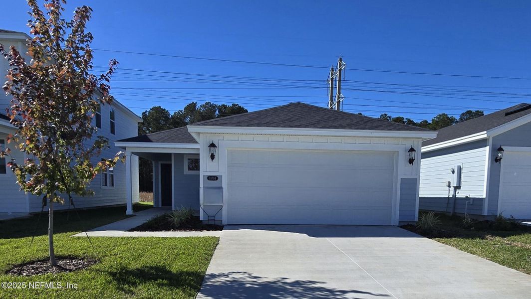 Front exterior of a new home in Kings Preserve, Jacksonville, FL, highlighting curb appeal (Image 1). Front exterior of a new home in Kings Preserve, Jacksonville, FL, highlighting curb appeal (Image 1).