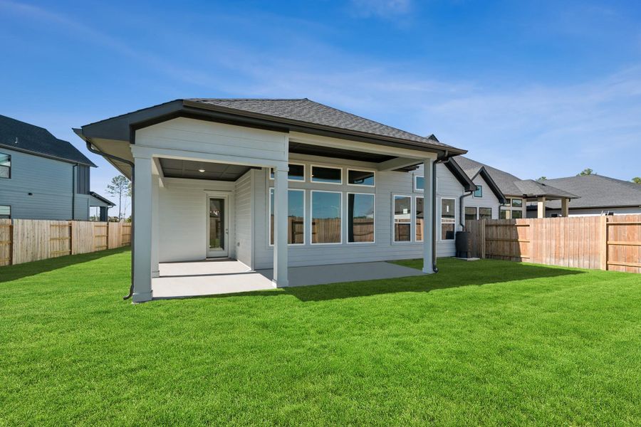 Exterior details and patio area of a home in ARTAVIA 50' Homesites, Conroe (Image 24).