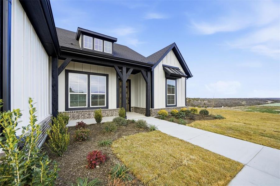 Front exterior of a new home in Eagle Ridge Estates, Weatherford, TX, highlighting curb appeal (Image 21).