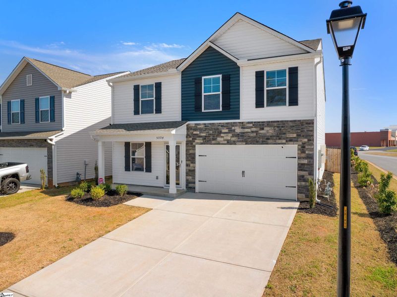 Front exterior of a new home in Hazelwood, Boiling Springs, SC, highlighting curb appeal (Image 17). Front exterior of a new home in Hazelwood, Boiling Springs, SC, highlighting curb appeal (Image 17).
