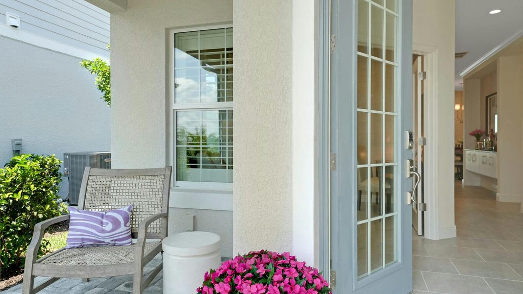 Exterior details and patio area of a home in SkySail Real Estate and Homes for Sale in Naples, FL - Neal Communities, Naples (Image 3).