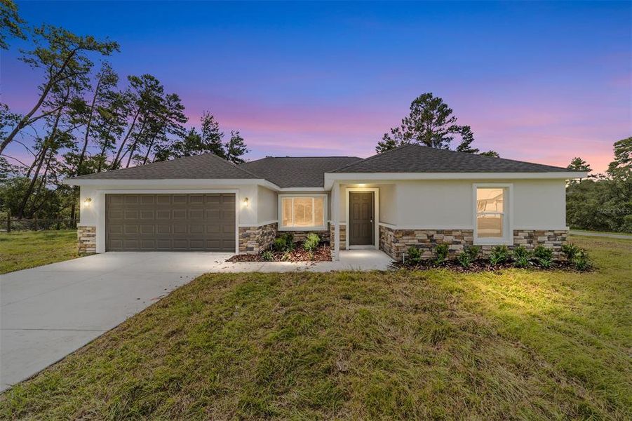 Front exterior of a new home in , Silver Springs, FL, highlighting curb appeal (Image 1).