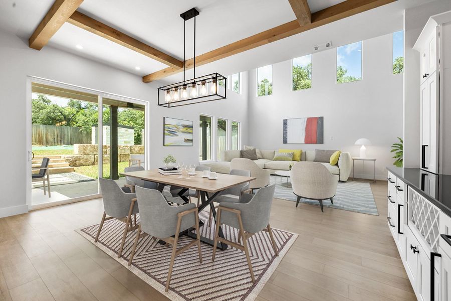 Dining area featuring beam ceiling, light wood-style floors, recessed lighting, a high ceiling, and baseboards Dining area featuring beam ceiling, light wood-style floors, recessed lighting, a high ceiling, and baseboards