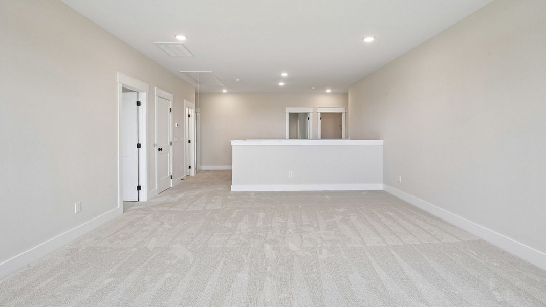 Loft area with carpet and access to bedrooms Loft area with carpet and access to bedrooms