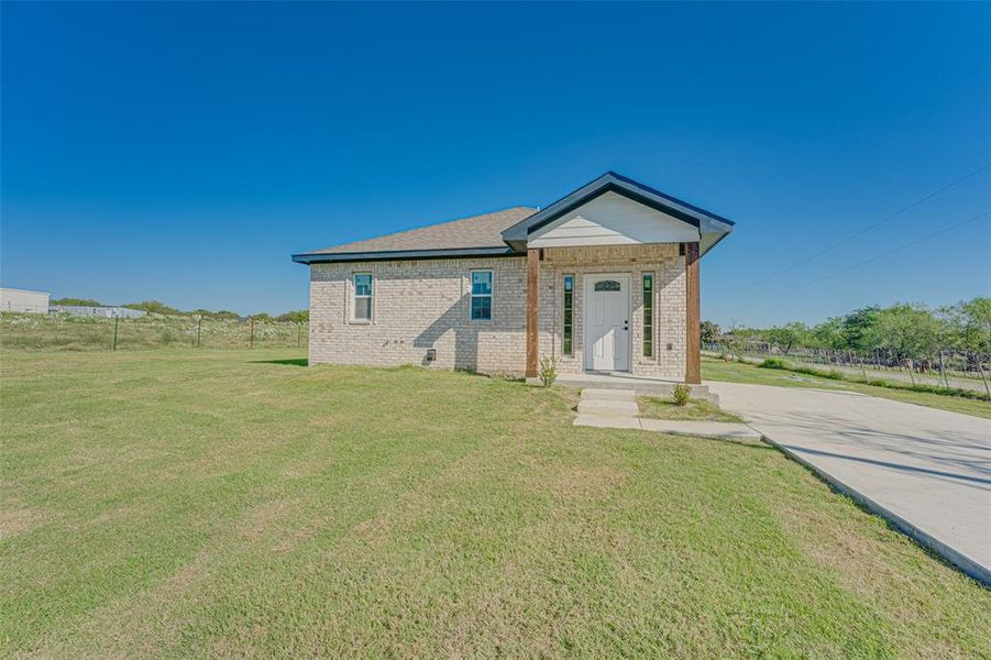 Front exterior of a new home in , Rice, TX, highlighting curb appeal (Image 1).