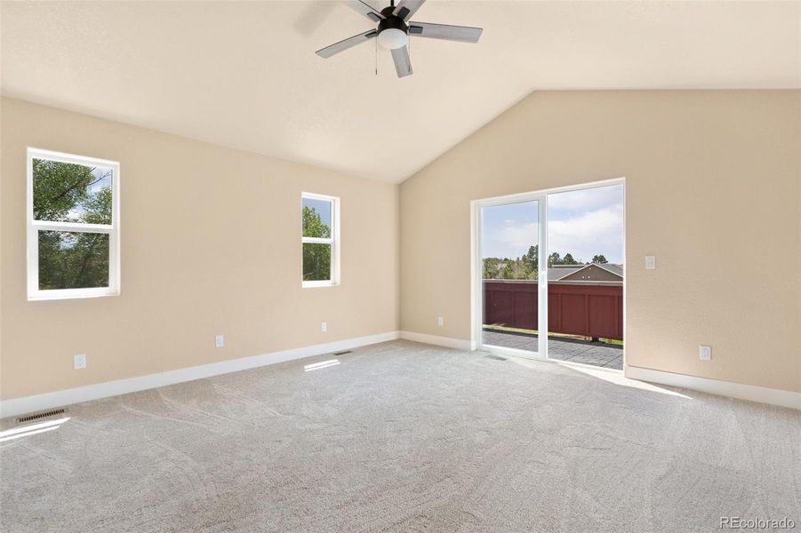 Primary bedroom suite with private balcony with stunning Front Range views and ensuite bathroom Primary bedroom suite with private balcony with stunning Front Range views and ensuite bathroom