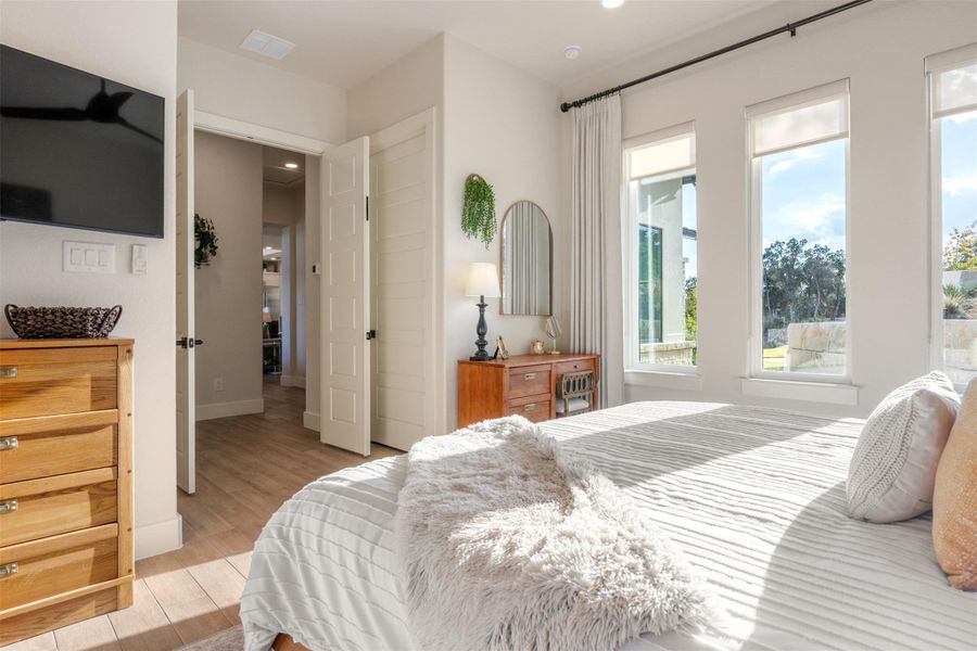 Bedroom featuring light hardwood / wood-style flooring Bedroom featuring light hardwood / wood-style flooring