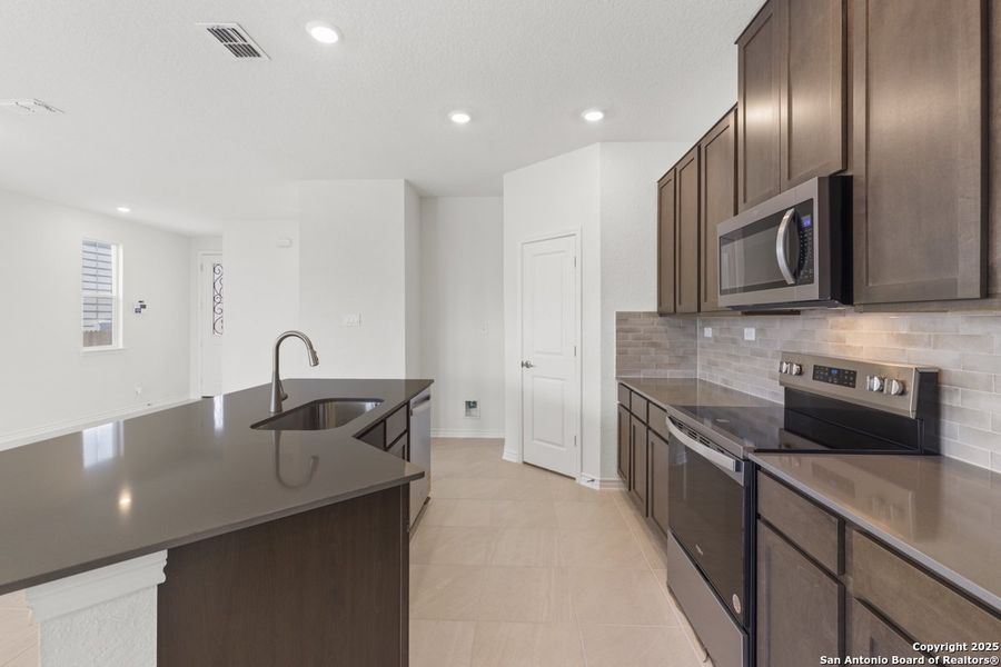 Furnished interior view inside a new home in Woodside Farms, Seguin (Image 4).
