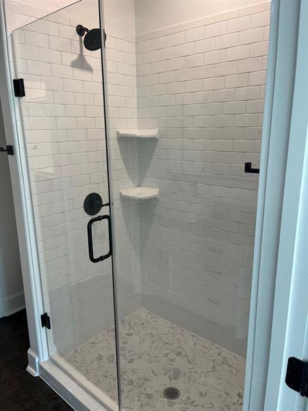 Full bathroom with a shower stall