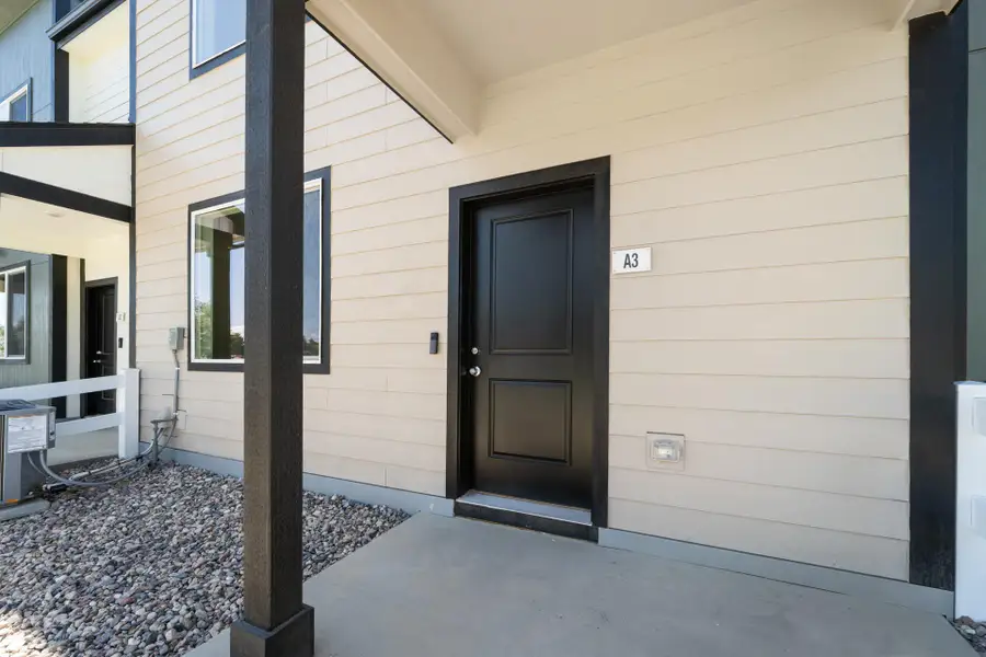 Exterior details and patio area of a home in Conestoga, Ault (Image 3).