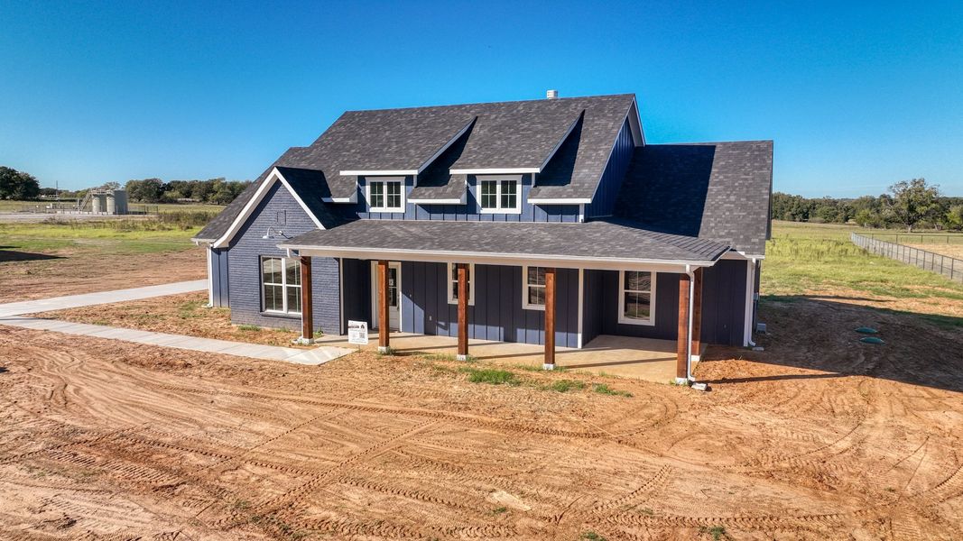 Front exterior of a new home in Horizon Meadow Estates, Paradise, TX, highlighting curb appeal (Image 2). Front exterior of a new home in Horizon Meadow Estates, Paradise, TX, highlighting curb appeal (Image 2).