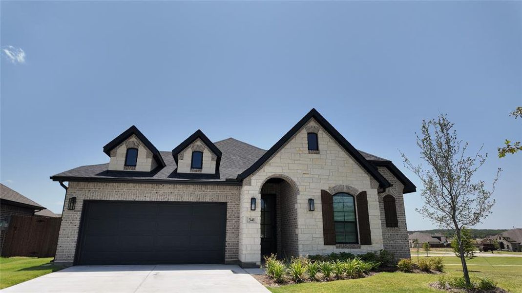 Front exterior of a new home in Panchasarp Farms, Burleson, TX, highlighting curb appeal (Image 2). Front exterior of a new home in Panchasarp Farms, Burleson, TX, highlighting curb appeal (Image 2).