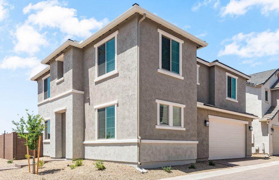 Front exterior of a new home in Asante- Atrium Series, Surprise, AZ, highlighting curb appeal (Image 19).