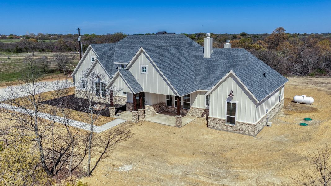 Representative exterior photo of a completed home built from the Rebekah by Zeal Home Builders in Oak Water Ranch, Granbury, TX (Image 31). Representative exterior photo of a completed home built from the Rebekah by Zeal Home Builders in Oak Water Ranch, Granbury, TX (Image 31).