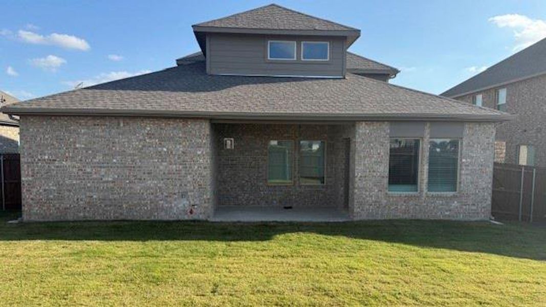 Exterior details and patio area of a home in Fireside by the Lake, Garland (Image 4).