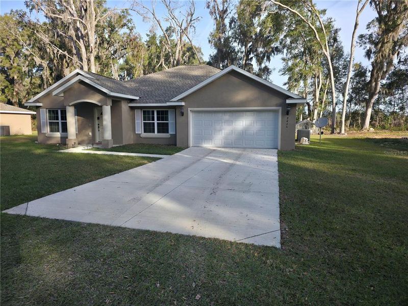 Front exterior of a new home in , Summerfield, FL, highlighting curb appeal (Image 1). Front exterior of a new home in , Summerfield, FL, highlighting curb appeal (Image 1).