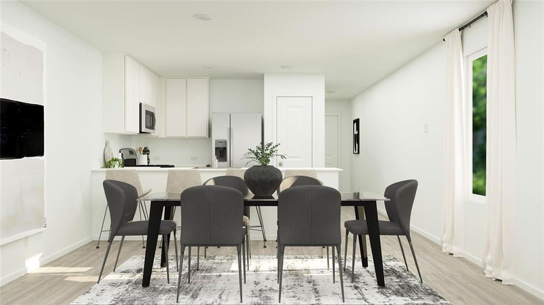 Dining area with plenty of natural light and light wood-type flooring