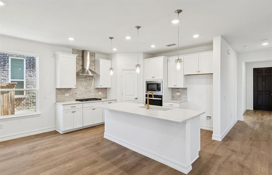 Spacious kitchen with eat-in bartop island