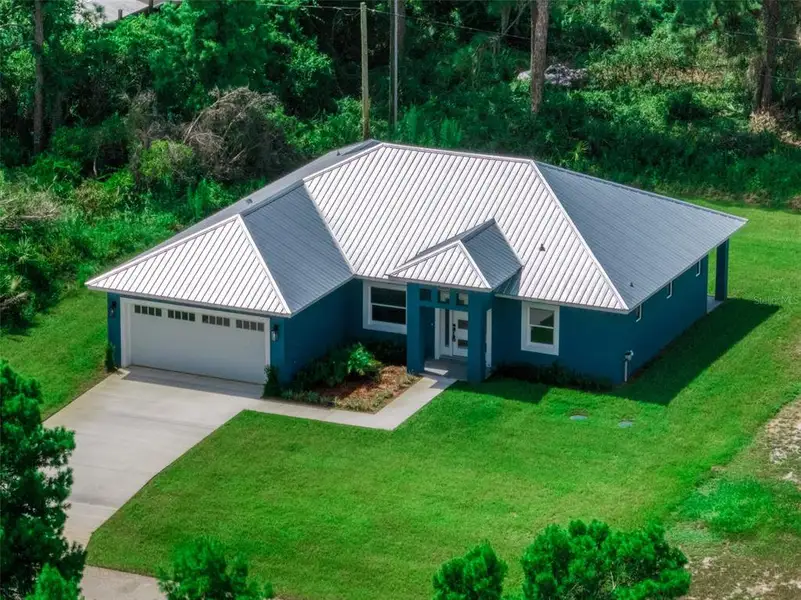 Front exterior of a new home in , Sebring, FL, highlighting curb appeal (Image 1). Front exterior of a new home in , Sebring, FL, highlighting curb appeal (Image 1).