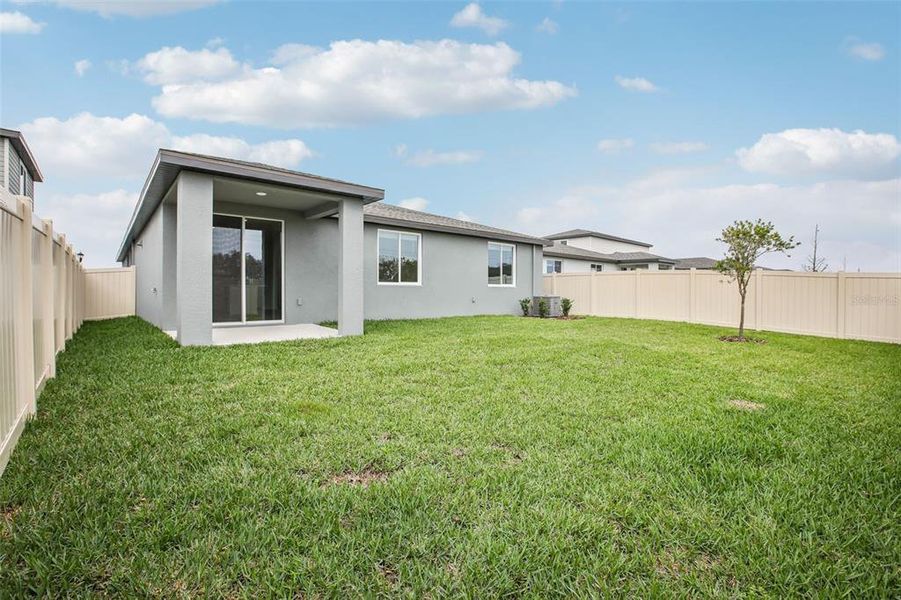 Exterior details and patio area of a home in Two Rivers - Classic Series, Zephyrhills (Image 4).