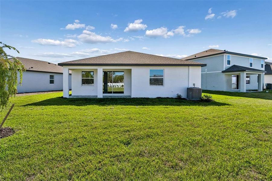 Exterior details and patio area of a home in Southpointe, Palmetto (Image 4).