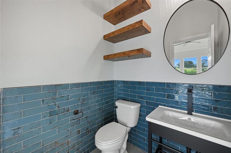 Bathroom with tile walls and wainscoting Bathroom with tile walls and wainscoting