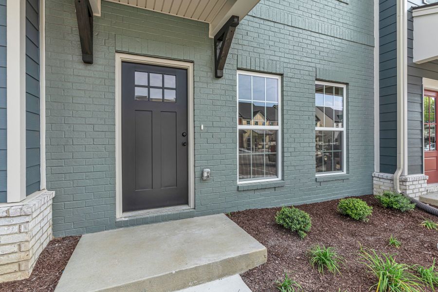 Front exterior of a new home in Oxford Station, Gallatin, TN, highlighting curb appeal (Image 17).