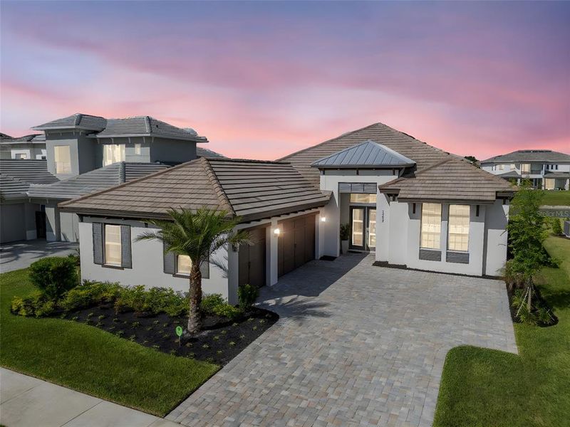 Front exterior of a new home in , Wesley Chapel, FL, highlighting curb appeal (Image 24).