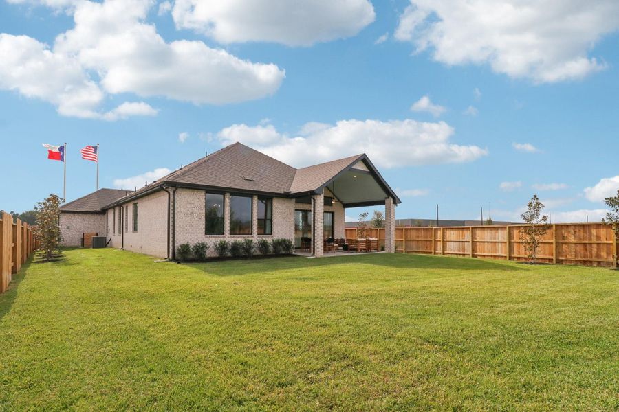 Exterior details and patio area of a home in The Woodlands Hills, Willis (Image 25).