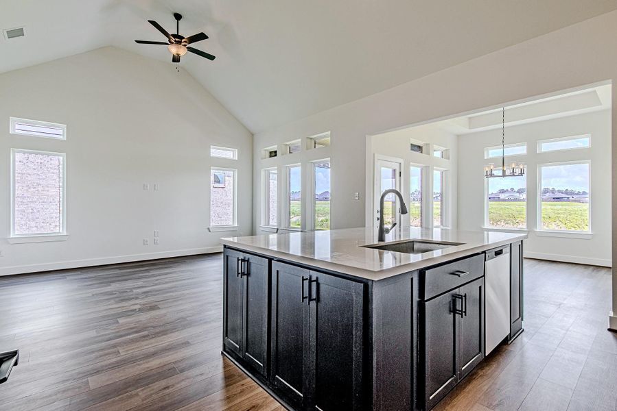 The oversized island offers additional seating, prep space, and serves as the perfect gathering spot for family and friends The oversized island offers additional seating, prep space, and serves as the perfect gathering spot for family and friends
