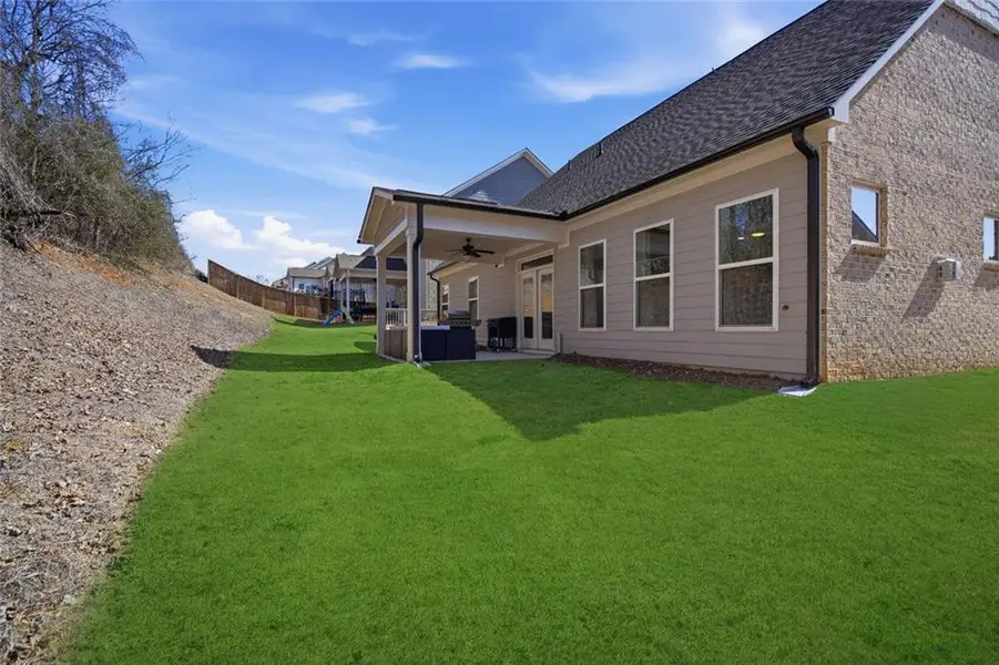Exterior details and patio area of a home in Cambridge, Flowery Branch (Image 25).