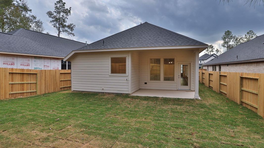 Exterior details and patio area of a home in Woodhavyn 40', Magnolia (Image 3).