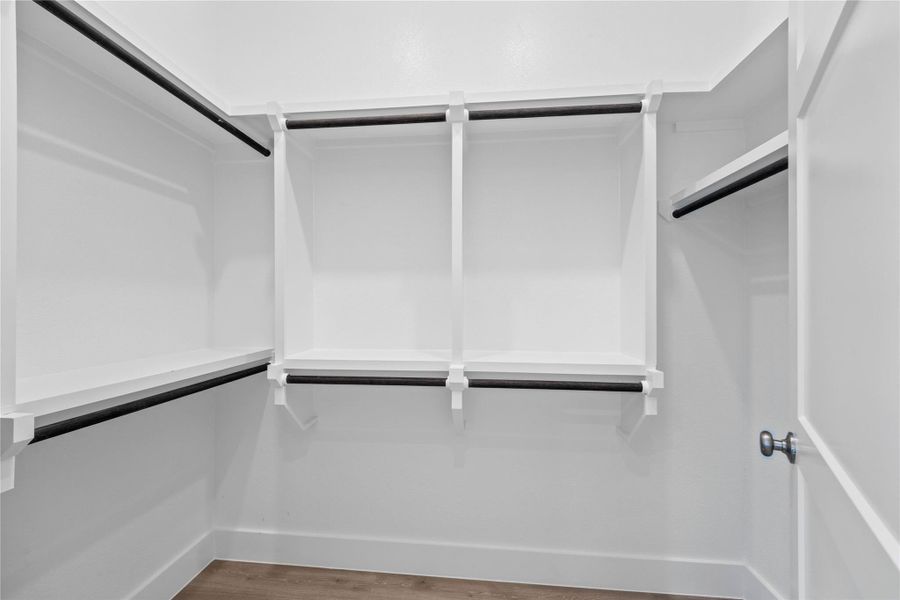 Look at this immaculate closet! With high shelving, multiple rows to hang clothing, you are sure to have enough room for all your belongings!