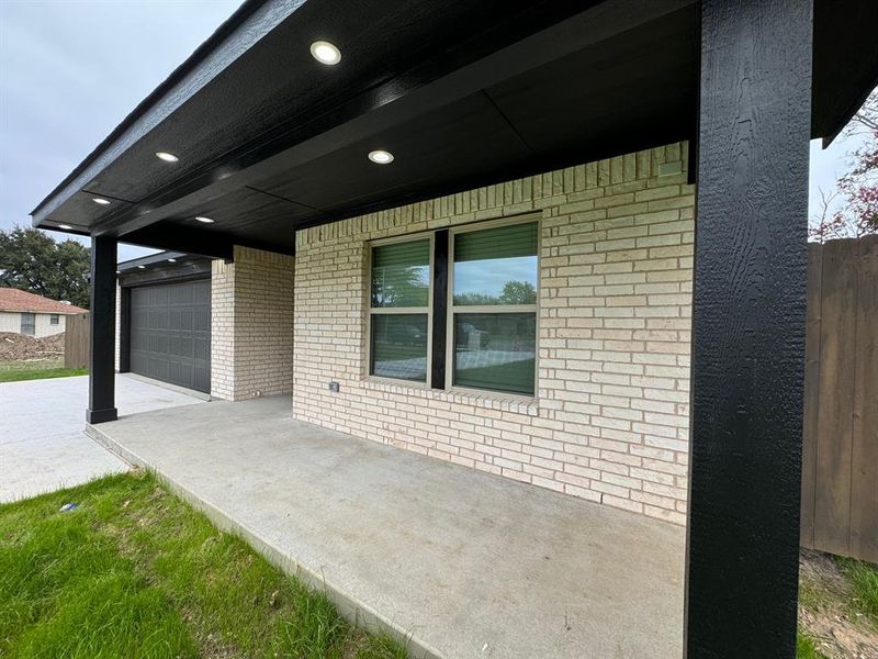 View of patio / terrace with a garage