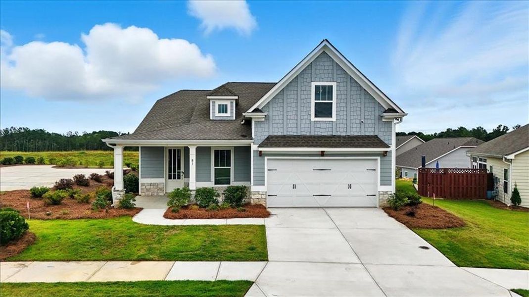 Front exterior of a new home in Heritage Pointe at The Georgian, Villa Rica, GA, highlighting curb appeal (Image 2). Front exterior of a new home in Heritage Pointe at The Georgian, Villa Rica, GA, highlighting curb appeal (Image 2).