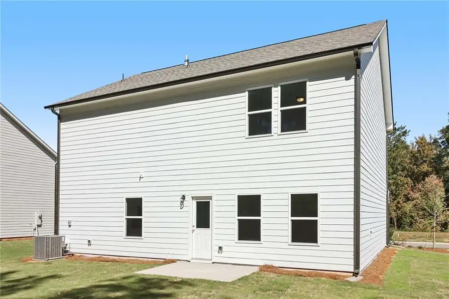 Exterior details and patio area of a home in The Pointe at Heron Bay, Locust Grove (Image 3).