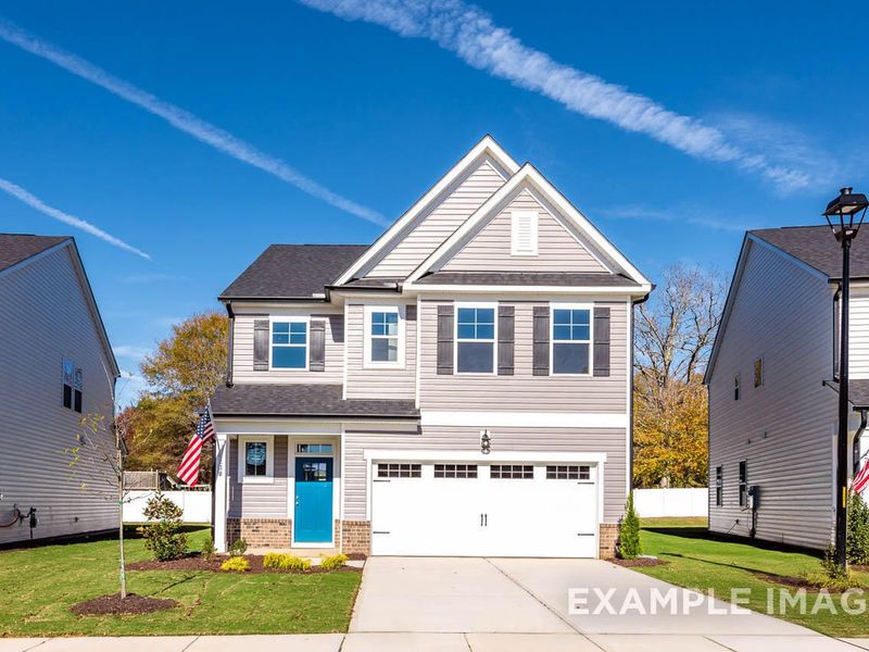 Front exterior of a new home in Gregory Village, Lillington, NC, highlighting curb appeal (Image 1).