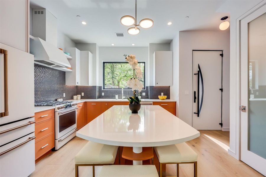 This is where the plans are made; a large granite-topped island designed for collaboration, coffee, or just catching up.