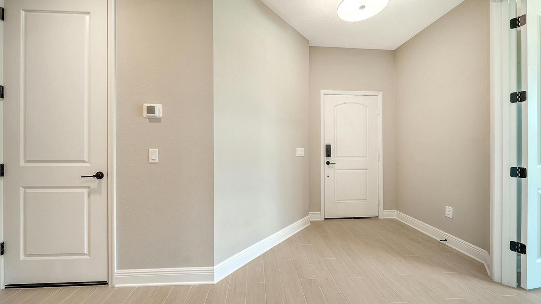 Spacious, unfurnished interior of a new home in Vicenza Real Estate and Homes for Sale in North Venice, FL - Neal Communities, Venice (Image 38).