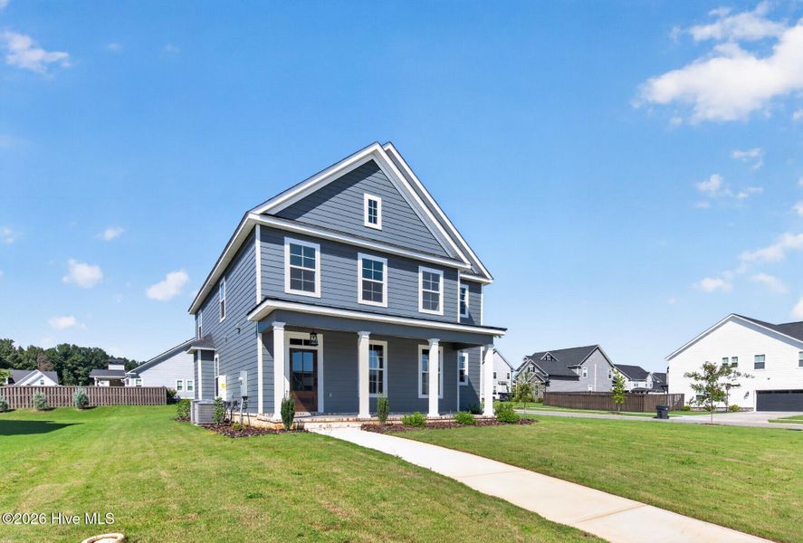Front exterior of a new home in Highland Lakes, Evans, GA, highlighting curb appeal (Image 21). Front exterior of a new home in Highland Lakes, Evans, GA, highlighting curb appeal (Image 21).
