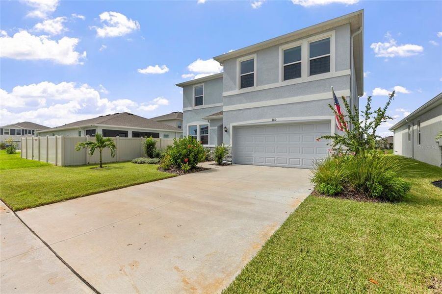 Front exterior of a new home in Silverstone North, Palmetto, FL, highlighting curb appeal (Image 2). Front exterior of a new home in Silverstone North, Palmetto, FL, highlighting curb appeal (Image 2).