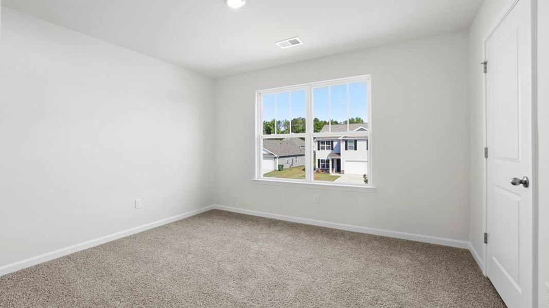 Spacious, unfurnished interior of a new home in Bentley Park, Greenwood (Image 26).