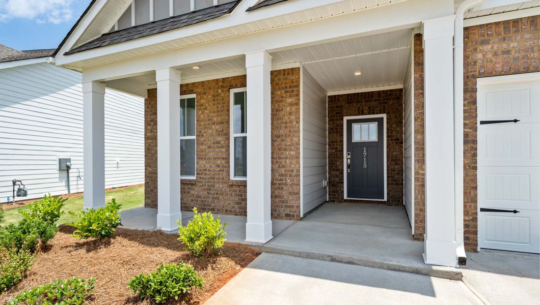 Front exterior of a new home in Seven Oaks, Greenwood, SC, highlighting curb appeal (Image 2).