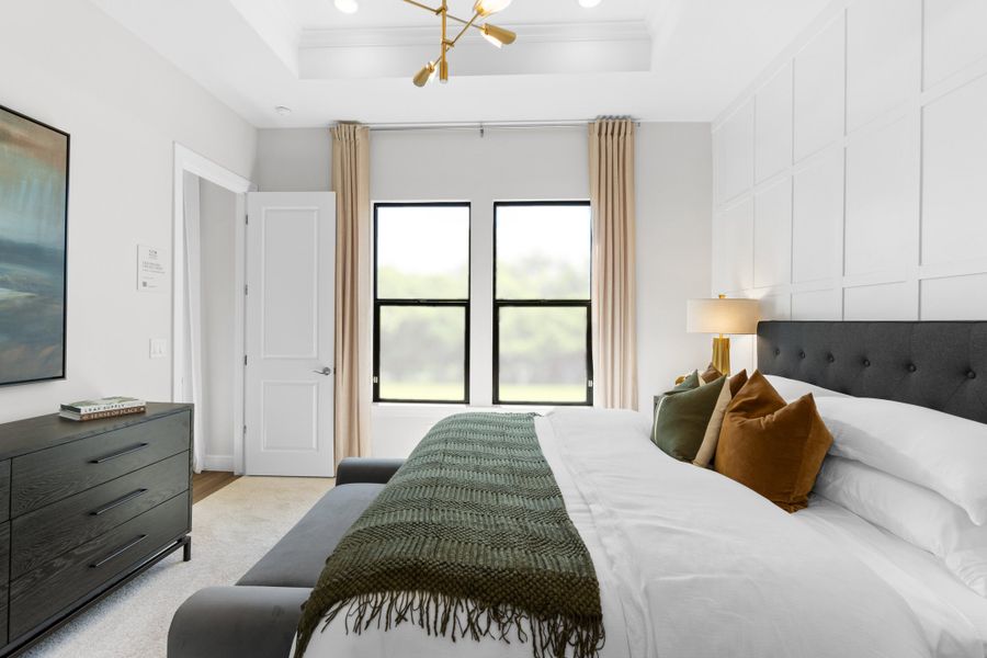 Primary suite with decorative feature wall Primary suite with decorative feature wall