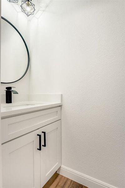 Bathroom with vanity and light wood-style floors