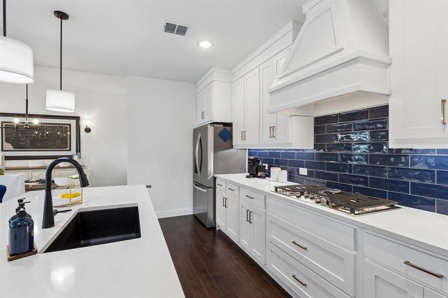 Kitchen
The oversized island provides seating, storage, and workspace, making it the natural gathering spot for casual meals and conversation.