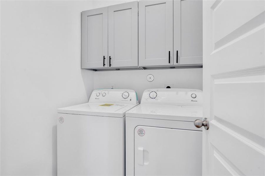 Laundry room comes equipped with a washer & dryer set, cabinets above the appliances. Plenty of room to do your laundry and space to keep your cleaning supplies.